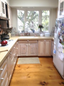 Kitchen at our house.  Cabinets and new floors of  wide different size planking of pine.  Bay window also added.